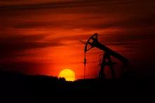  Pump-jack mining crude oil with the sunset